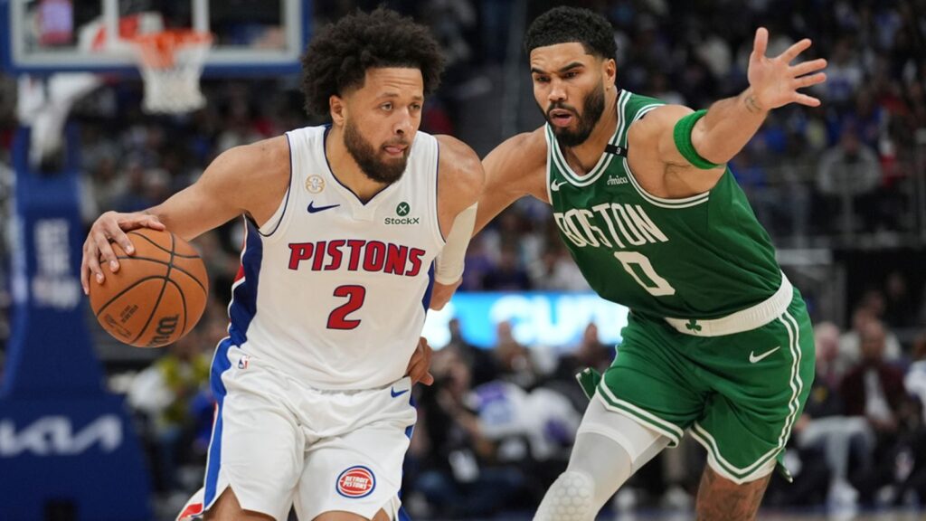 Detroit Pistons guard Cade Cunningham (2) drives on Boston Celtics forward Jayson Tatum (0) in the NBA season tip off