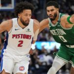 Detroit Pistons guard Cade Cunningham (2) drives on Boston Celtics forward Jayson Tatum (0) in the NBA season tip off